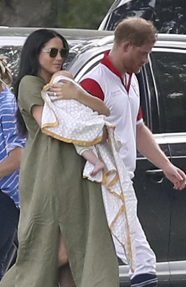 Prince Harry and Meghan with their son Archie at the Royal Charity Polo Day last week. Picture: Andrew Matthews/PA via AP