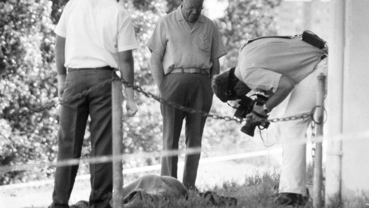 Police at murder scene with the body of Edward Baldock at Orleigh Park in Brisbane’s West End.