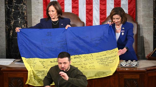 Ukraine President Volodymyr Zelensky speaks after giving a Ukrainian national flag to House Speaker Nancy Pelosi and Vice President Kamala Harris. Picture: AFP