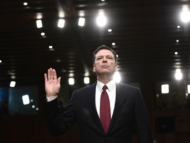 Former FBI Director James Comey takes the oath before he testifies during a US Senate Select Committee on Intelligence. Picture: AFP