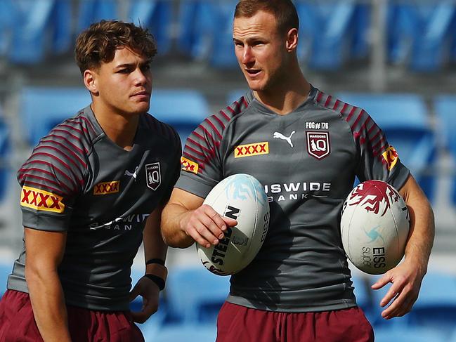 GOLD COAST, AUSTRALIA - JUNE 22: Reece Walsh  and Daly Cherry-Evans talk during a Queensland Maroons State of Origin training session at the Cbus Super Stadium on June 22, 2021 in Gold Coast, Australia. (Photo by Chris Hyde/Getty Images)