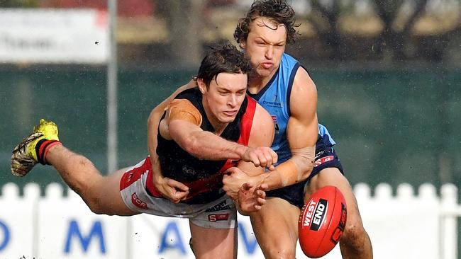 West's Joshua Schiller and Sturt's Jack Penfold compete for the ball. Picture: Tom Huntley