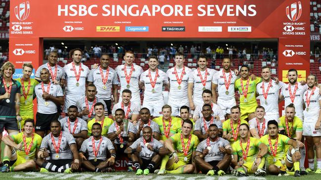 Medallists Fiji, Australia and England pose for a photo at the Singapore Sevens.
