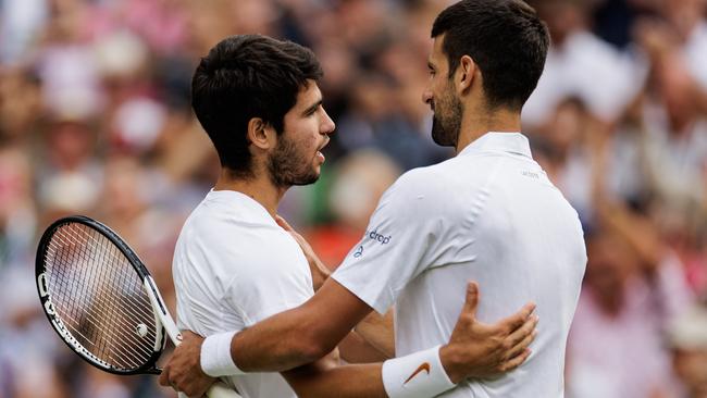 Novak Djokovic embraces Carlos Alcaraz after the Wimbledon men’s singles final. Picture: Frey/TPN/Getty Images