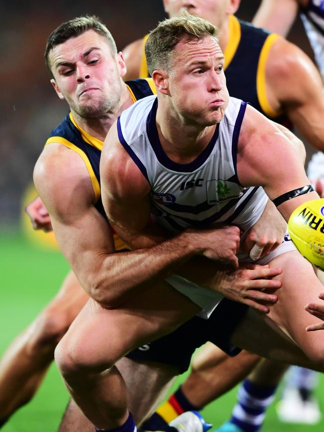 Brad Crouch tackles Fremantle’s Brandon Matera. Picture: MARK BRAKE/GETTY