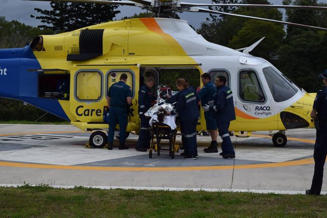 The 12-year-old Monkland girl who suffered serious burns and smoke inhalation in a house fire is transferred to a Careflight helicopter to be flown to Lady Cilento Children's Hospital. Picture: Francesca Mcmackin