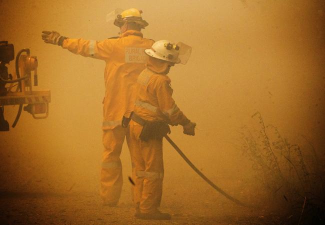 Fire crews battle bushfires at Little Mountain on the Sunshine Coast. Picture: Lachie Millard