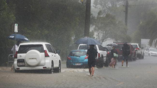 Major flooding in Millers rd at Currumbin. Media run to move their cars to avoid being part of the story. Picture Glenn Hampson