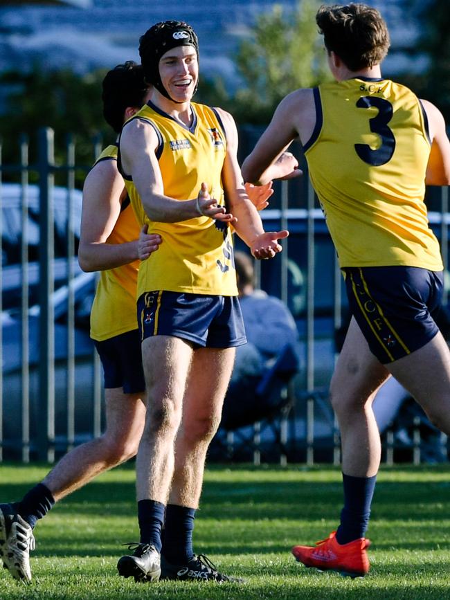 Walter celebrates a goal with teammates during a Messenger Shield match last season. Picture: AAP/Morgan Sette