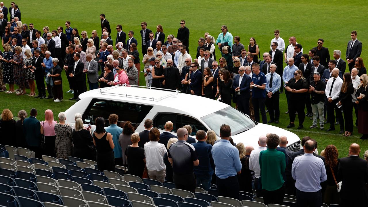 A guard of honour is formed as the hearse leaves the arena during Troy Selwood's farewell.