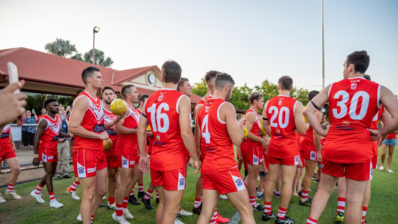 The Waratahs pay tribute to late, great ruckman Alexander ‘Rooch’ Aurrichio at the first game under lights at Gardens Oval. Picture: Aaron Black/AFLNT Media