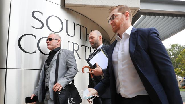 Jayden Moorea (left) arrives with his legal team for day 3 of the committal hearing at Southport Magistrates Court. Photo: Scott Powick.