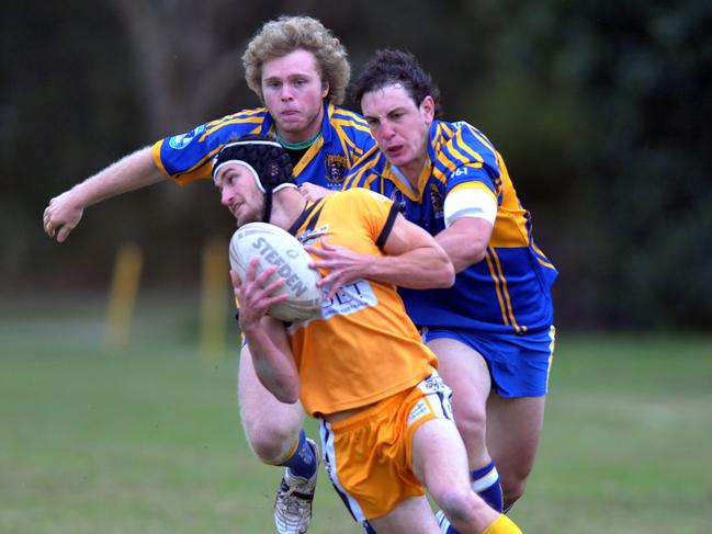 Caloundra fullback Adam Shuttlewood evades Noosa defence in 2010.