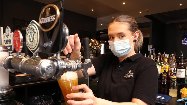 Ballarat going into Covid lockdown. Bunch of Grapes Hotel bar tender Katlyn Randall, pours one of her last beers before lockdown again. Picture: David Caird