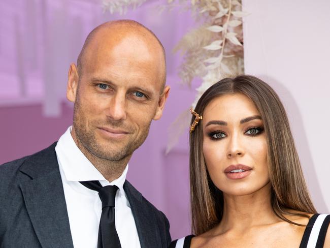 MELBOURNE, AUSTRALIA - NOVEMBER 02: Nick Russian and Rozalia Russian poses in the Bumble marquee on Derby Day at Flemington Racecourse on November 02, 2019 in Melbourne, Australia. (Photo by Mackenzie Sweetnam/Getty Images)