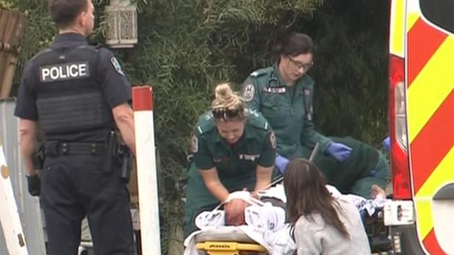 Emergency crews raced to Hamilton Rd around 12.40pm, where the man was found with a knife still lodged in his hand. Picture: 7NEWS