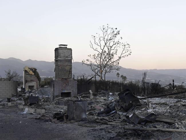 GONE: Destroyed houses with Santa Monica Mountains in the background after the November Woolsey Fire hit Malibu, California. Picture: KEVORK DJANSEZIAN/GETTY IMAGES/AFP