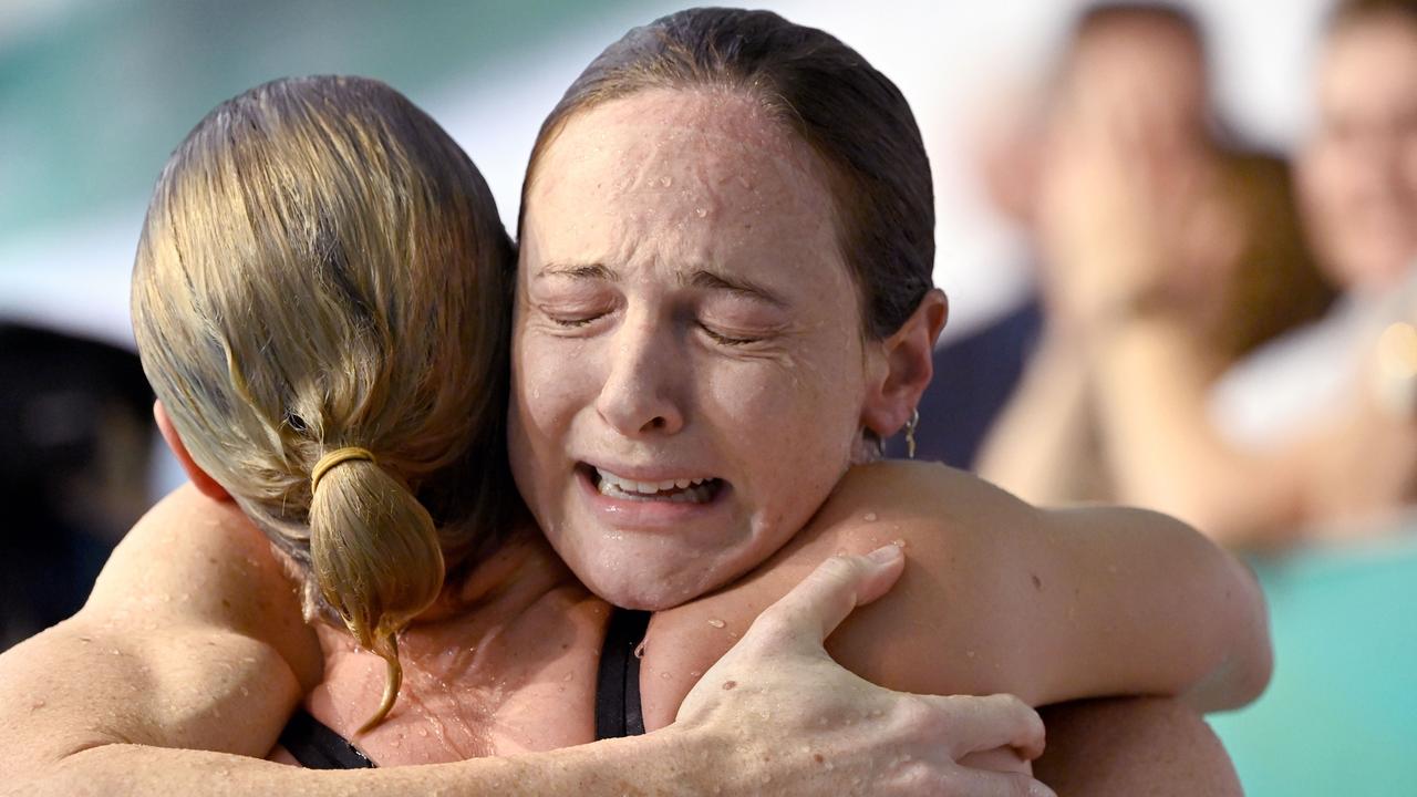 An emotional Cate Campbell hugs her sister Bronte after qualifying in the 100m free at the Australian Olympic swimming trials.