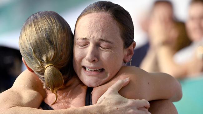 An emotional Cate Campbell hugs her sister Bronte after qualifying in the 100m free at the Australian Olympic swimming trials.