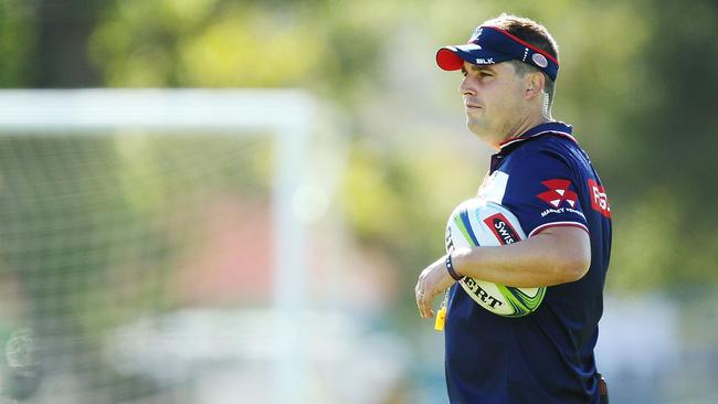 Coach Dave Wessels instructs players during a Rebels training session.