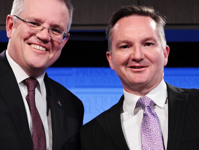 Treasurer Scott Morrison (left) and Shadow Treasurer Chris Bowen shake hands after the Treasurers Debate at the National Press Club in Canberra, Friday, May 27, 2016. (AAP Image/Stefan Postles) NO ARCHIVING