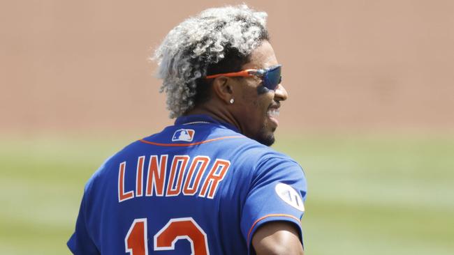 JUPITER, FLORIDA - MARCH 17: Francisco Lindor #12 of the New York Mets looks on against the Miami Marlins during the fourth inning of a Grapefruit League spring training game at Roger Dean Stadium on March 17, 2021 in Jupiter, Florida.   Michael Reaves/Getty Images/AFP == FOR NEWSPAPERS, INTERNET, TELCOS & TELEVISION USE ONLY ==