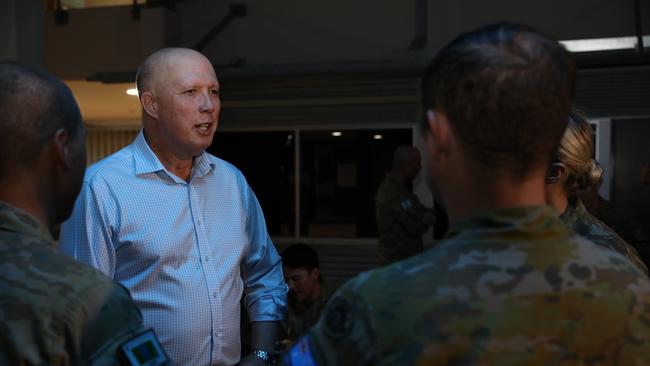 Minister for Defence Peter Dutton speaks with military personnel at Lavarack Barracks in Townsville on Thursday. Picture: Max Bree