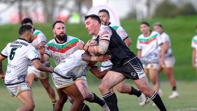 Luke Douglas charges into the Northern United defence. Picture: DC Sports Photography