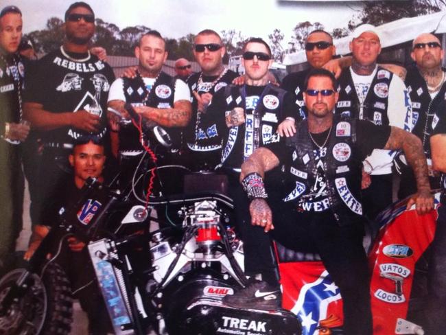 Rebels including Chris Rymer (left, white T-shirt, black vest), Matt King (front centre with black long-sleeves and Simon Rasic (at front on bike).