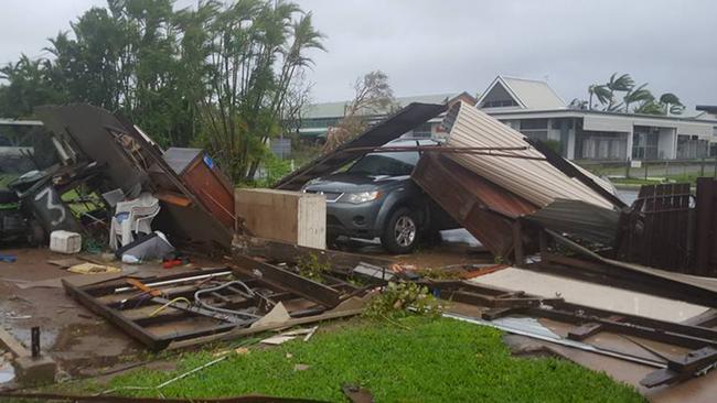 This image out of Proserpine was posted to Facebook by Rachel Harm with the caption: 'My yard and the neighbours shed which is now in my backyard' Picture: Rachel Harm/Facebook