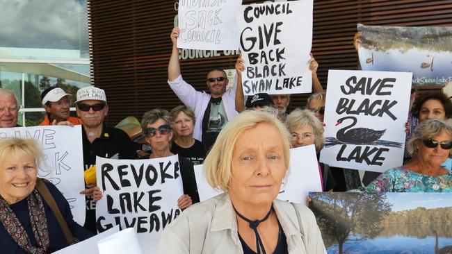 Sally Spain from Wildlife Queensland leads a group of protesters trying to save Black Swan Lake outside Gold Coast City Council Chambers armed with a petition signed by 38.000 people. Picture Glenn Hampson.