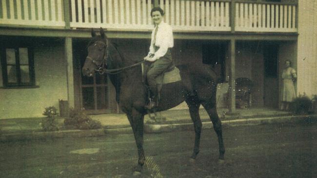 Victoria Alice May Backhouse (nee Frost) pictured on her horse with her mum in the background in the late 1930s. Picture: Supplied