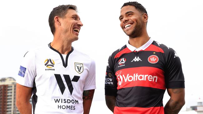 Mark Milligan of Macarthur FC poses with Kwame Yeboah of Western Sydney Wanderers ahead of their opening game of the A-league season.