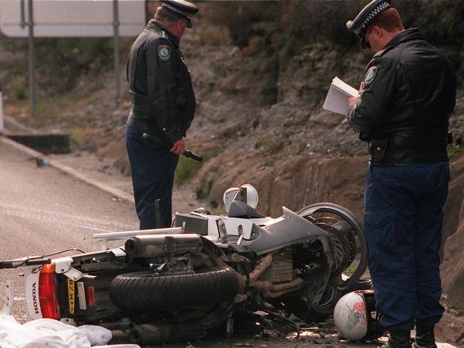 Police inspect the scene where Senior Sergeant Ray Smith was killed.