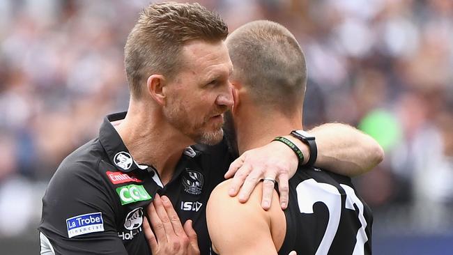 Magpies coach Nathan Buckley consoles Steele Sidebottom after the game. Picture: Getty Images