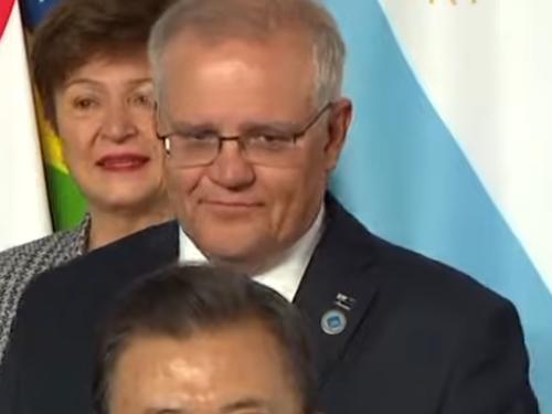 Scott Morrison given the cold shoulder during the G20 family photo in Rome. Source: 7News via NCA NewsWIre