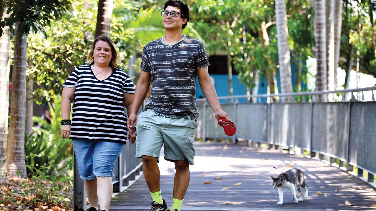 Natalie Weston and Nicolas Capone take their cat Ninja for a walk.