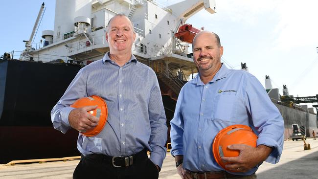 QSL Chief Executive Officer and Managing Director Greg Beashel and Canegrowers chairman Owen Menkins, oversee Australia’ first raw sugar shipment to the United Kingdom under the New Australia-United Kingdom Free Trade Agreement at Townsville port. Picture: Shae Beplate.