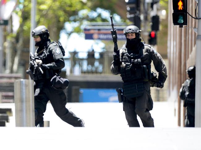 Police surrounding the Lindt cafe. Picture: Chris McKeen