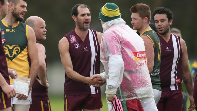 O’Sullivan Beach Lonsdale’s forward Trevor Rigney being congratulated for kicking 100 goals in 2018. Rigney starred in the clash against Flinders University on Saturday, booting nine majors. Picture: Dean Martin