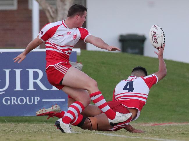 PBC’s Daniel Butturini and Deine Mariner in a strange dance to try and score off a kick. Picture: Glenn Hampson