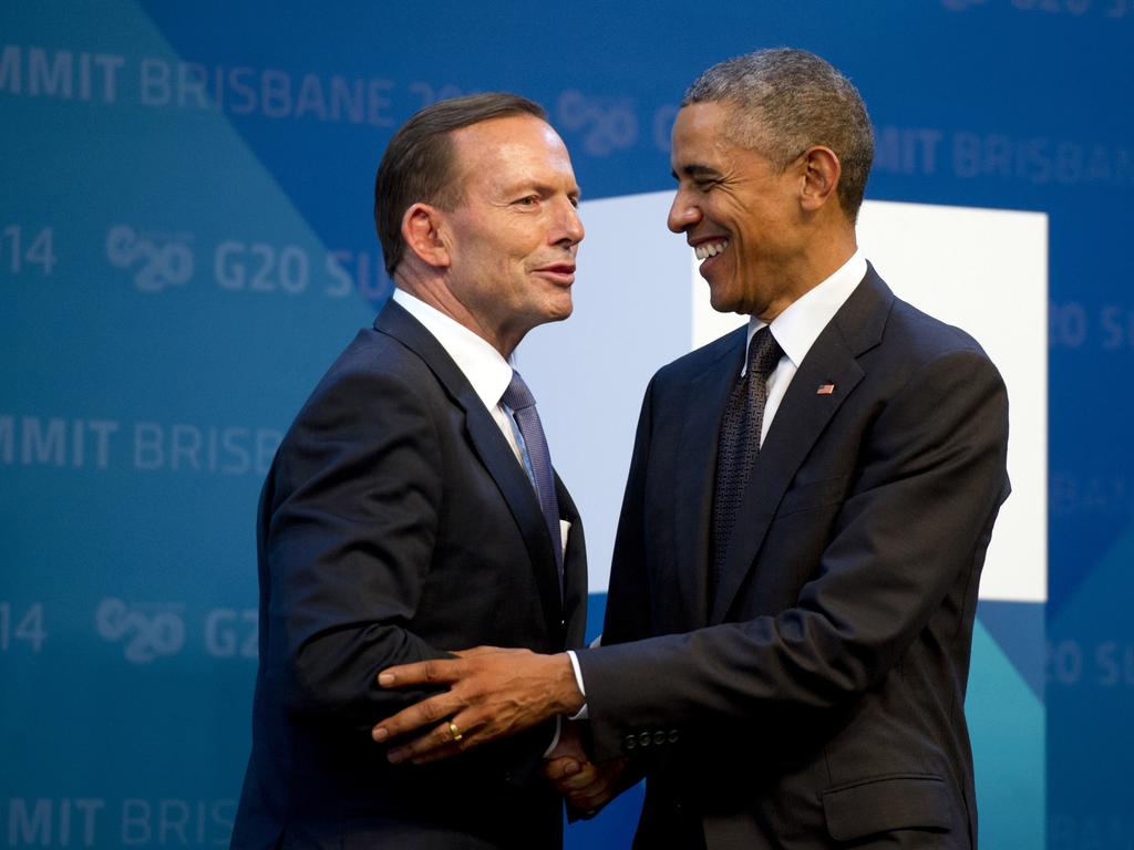 Barack Obama, pictured by with former Minister Tony Abbott, was the last US president to visit Australia. Picture: Alain Jocard / AP Photo