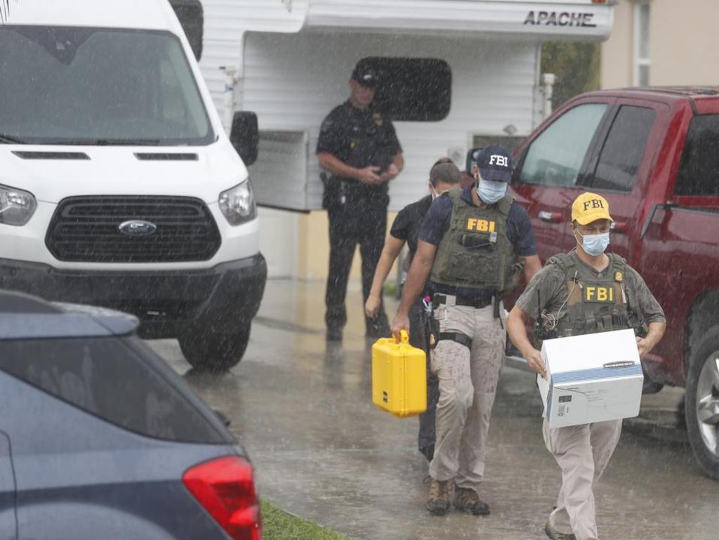 FBI agents begin to take away evidence from the family home of Brian Laundrie.