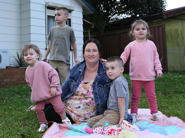 02/05/2024. BUDGET. Cara Delarue, 36, pictured with her four children at home in Blackett in Sydney's Western suburbs, Elijah, 6; Cohen, 4; Madelyn, 3 and Ivory, 1. Three of the children are on the NDIS, the eldest with an autism diagnosis, the other two with developmental delay. Cara says the NDIS has been vital to Elijah's ability to talk, having gone from non-verbal three years ago to no longer needing speech therapy now. She is pouring support therapies into her children early to give them the best chance for an independent life. Cara is worried that the rules are changing for her fourth, suspecting that Ivory will also need some support services, but that the NDIS might be unavailable to her. Britta Campion / The Australian