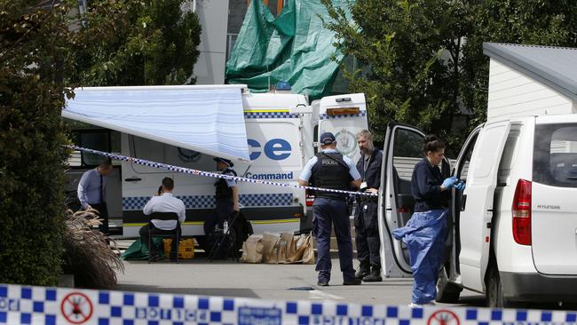 Police and forensic officers gather evidence at the home on Saturday. Picture: AAP Image/Darren Pateman