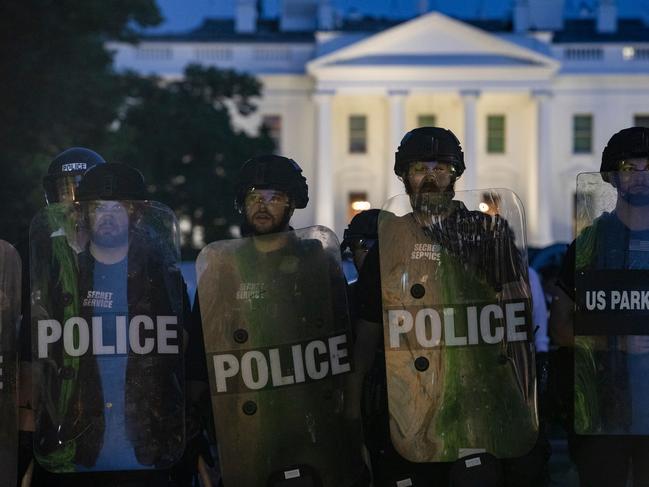 Police stand guard outside the White House.