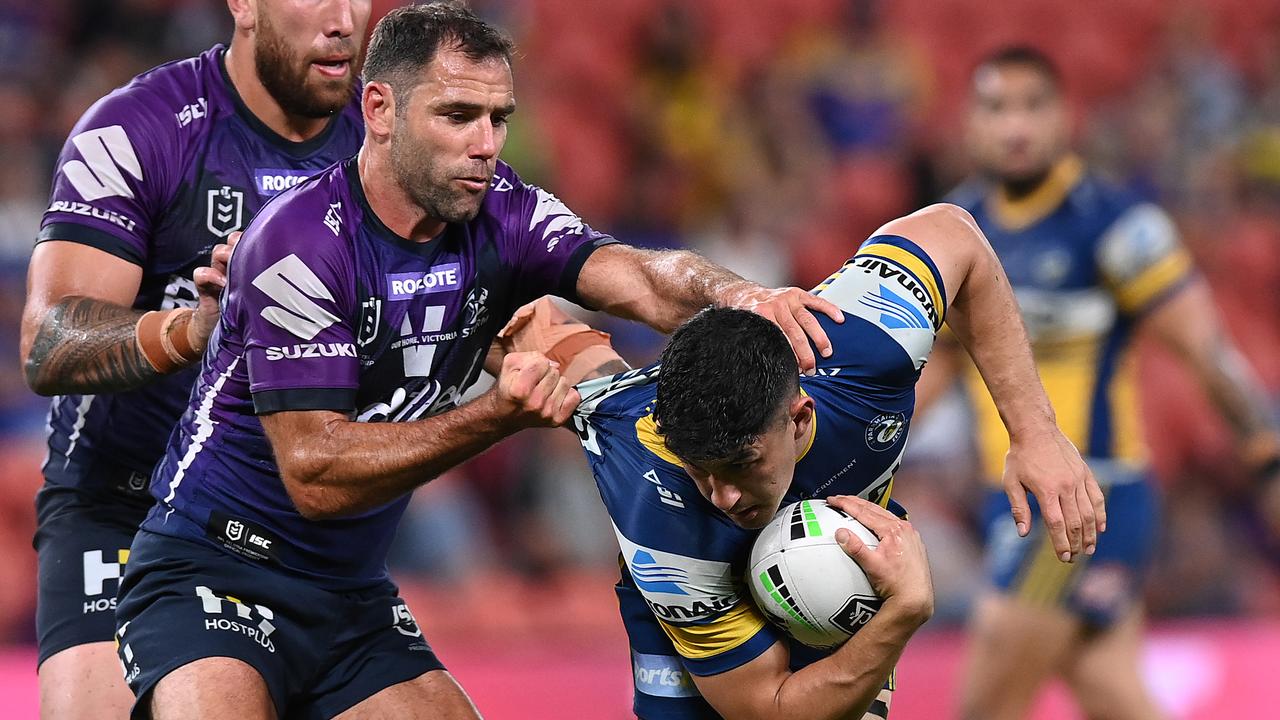 Cameron Smith tackles Dylan Brown.