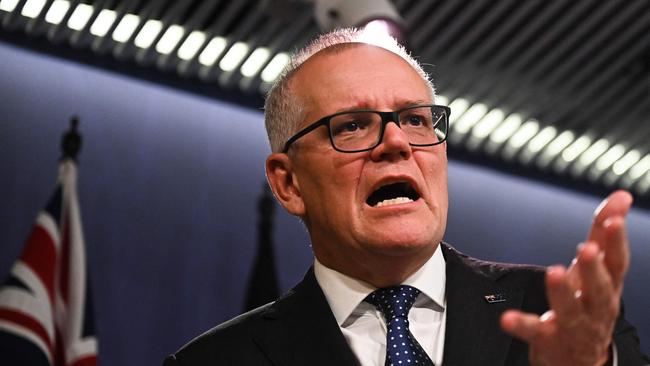 Australia's former prime minister Scott Morrison speaks to media during a press conference in Sydney on August 17, 2022. - Australia's Prime Minister Anthony Albanese on August 16 said that his predecessor Scott Morrison secretly seized control of five ministerial posts, labelling it an "unprecedented trashing of our democracy". (Photo by Steven Saphore / AFP)