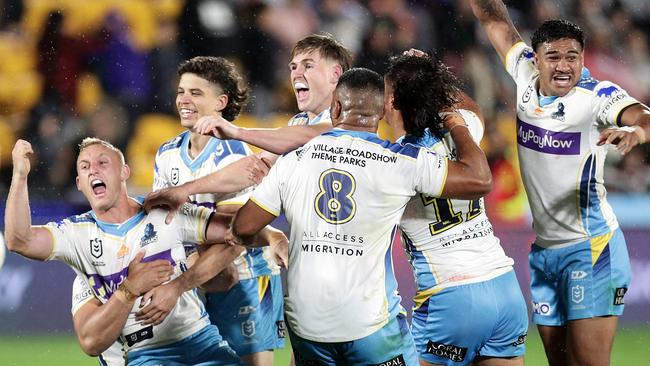 Tanah Boyd (left) celebrates his golden point field goal against the Warriors last year. Picture: Getty Images