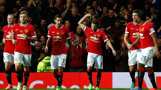 Juan Mata of Manchester United celebrates scoring.